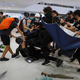 A policeman is attacked by protesters inside a mall in Sha Tin in Hong Kong, July 14, 2019.